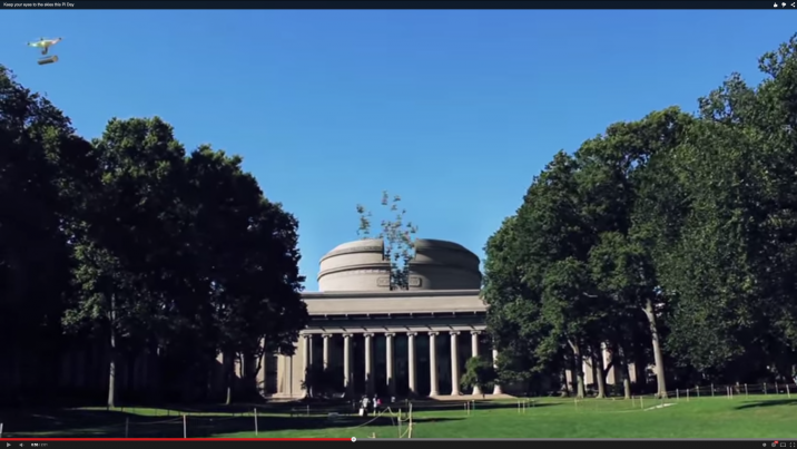 Screen capture of Pi Day video, with drones flying out of MIT dome