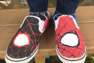 Photo of the co-author's feet wearing Spider-Man themed shoes